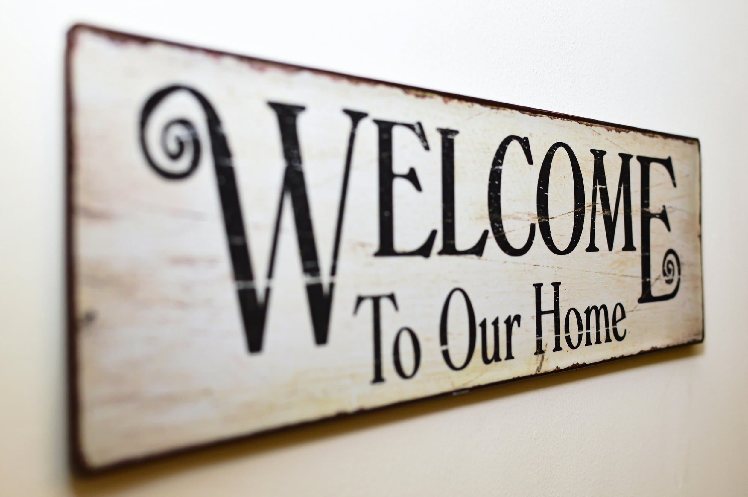 Welcome-to-our-home sign at a West Virginia short-term rental cabin.